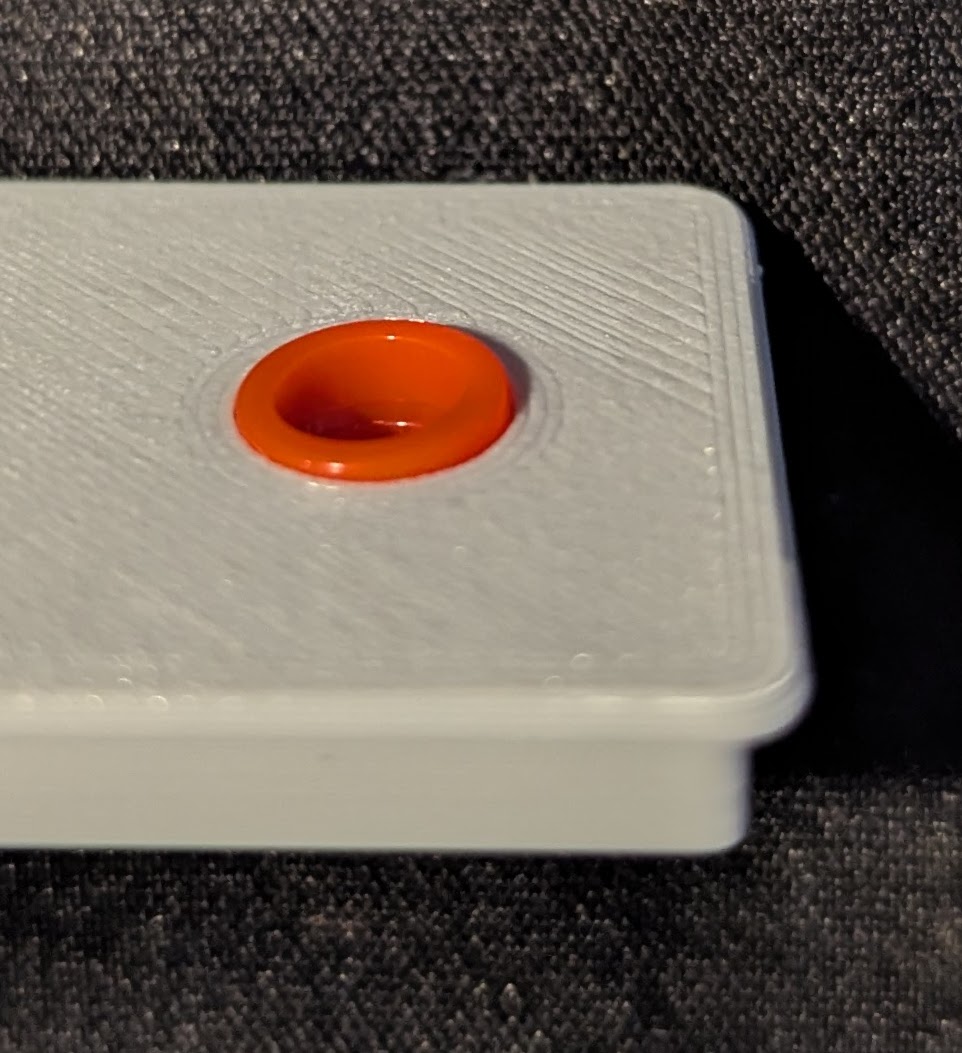Shouldered ring protruding from panel (front)